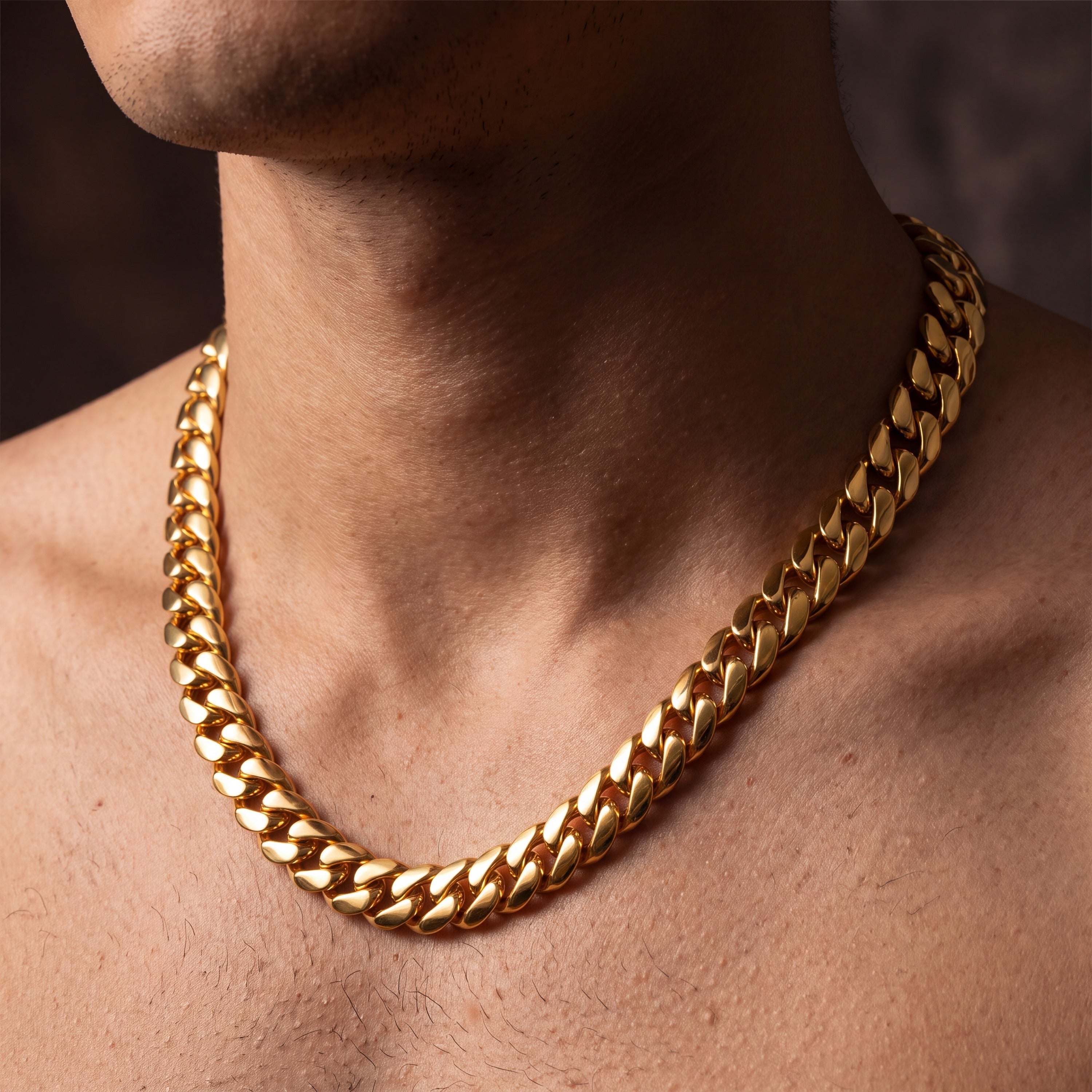 18K gold plated Miami Cuban link chain worn on a man's neck, plain polished domed links